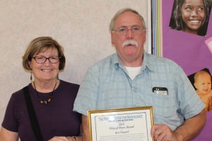 Angela Price and Ron Vineyard with Award